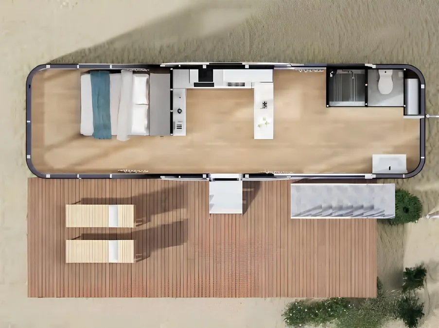 Plan vu de dessus d'une maison capsule : espace nuit, cuisine linéaire, salle de bain séparée et terrasse bois attenante